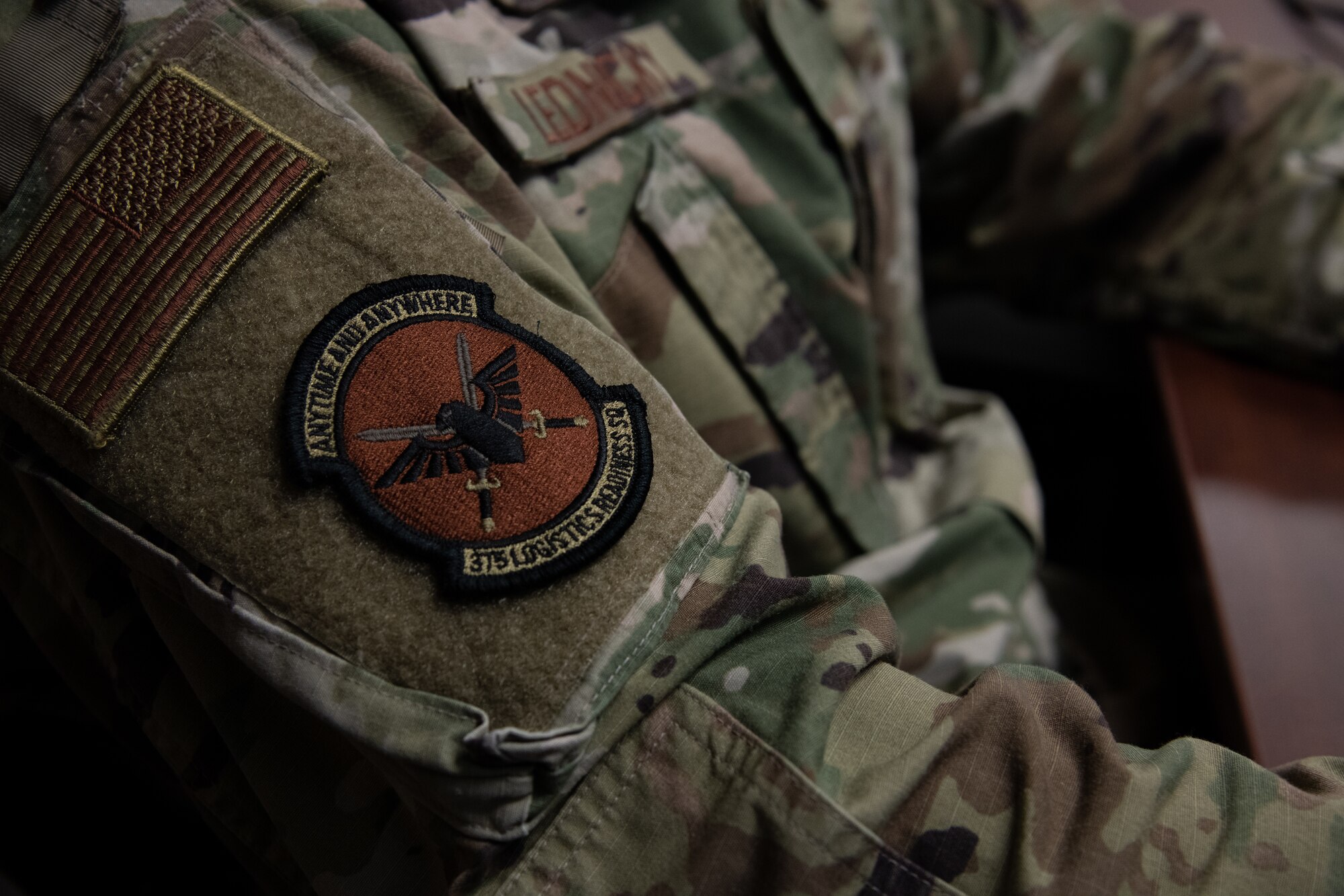 A 375th Logistics Readiness Squadron patch affixed to the uniform of Airman 1st Class Kyle Lednicky, 375th Logistics Readiness Squadron logistics planner, on Scott Air Force Base, Ill., April 2, 2021. The 375h LRS provides logistic support to Scott AFB and tenant units to enable rapid global mobility. (U.S. Air Force photo by Shannon Moorehead)