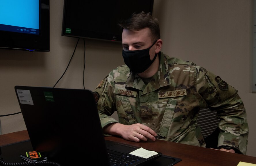 Airman 1st Class Kyle Lednicky, 375th Logistics Readiness Squadron logistics planner, works on deployment system utilization at the installation deployment readiness center on Scott Air Force Base, Ill., April 2, 2021.  Deployment system utilization catalogs the movement of cargo and personnel. (U.S. Air Force photo by Airman 1st Class Shannon Moorehead)