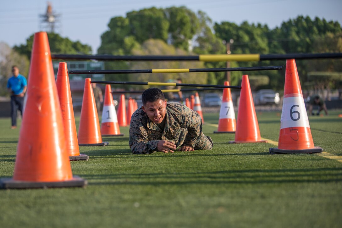 U.S. Marines with Headquarters and Headquarters Squadron (H&HS), compete in the monthly squadron competition on Marine Corps Air Station Yuma, Ariz., Oct. 9, 2020. The competition consisted of various challenges and obstacles as a way of improving morale and comradery while raising esprit de corps through competition. (U.S. Marine Corps photo by Lance Cpl. John Hall)