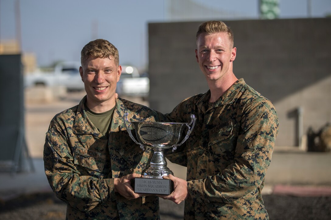 U.S. Marines with Headquarters and Headquarters Squadron (H&HS), compete in the monthly squadron competition on Marine Corps Air Station Yuma, Ariz., Oct. 9, 2020. The competition consisted of various challenges and obstacles as a way of improving morale and comradery while raising esprit de corps through competition. (U.S. Marine Corps photo by Lance Cpl. John Hall)