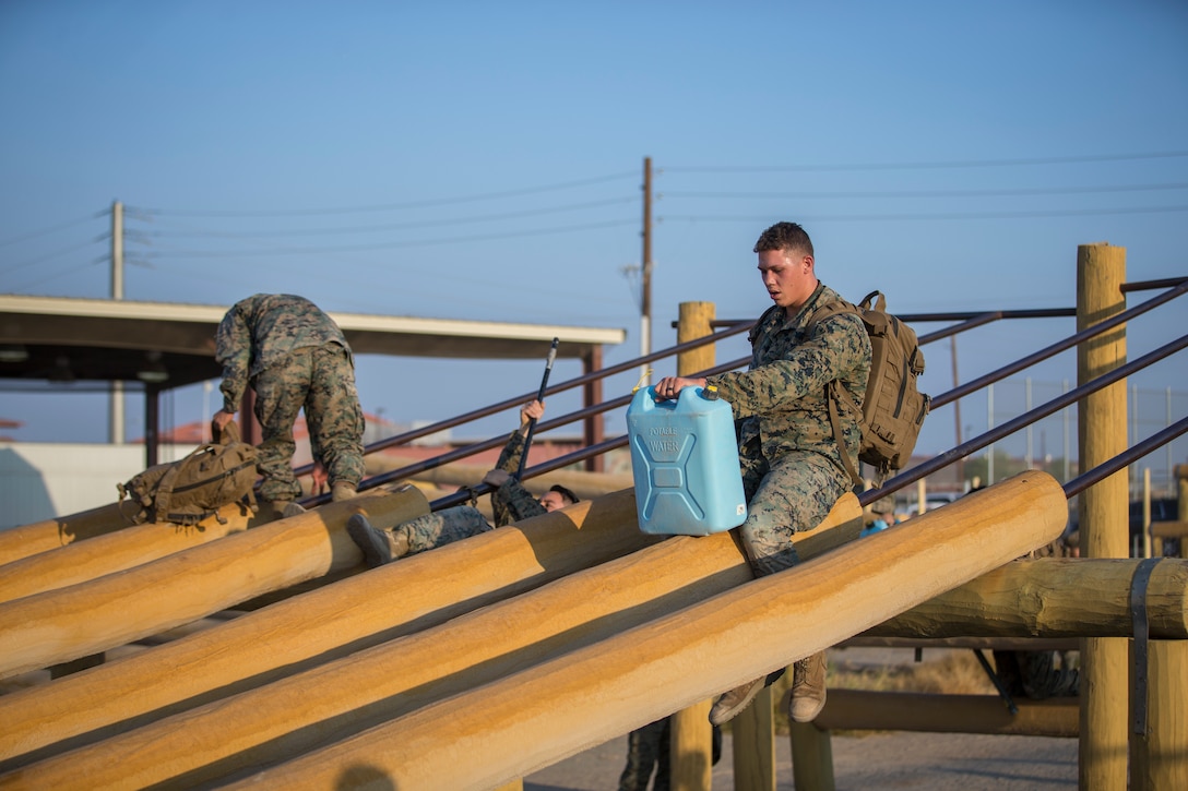 U.S. Marines with Headquarters and Headquarters Squadron (H&HS), compete in the monthly squadron competition on Marine Corps Air Station Yuma, Ariz., Oct. 9, 2020. The competition consisted of various challenges and obstacles as a way of improving morale and comradery while raising esprit de corps through competition. (U.S. Marine Corps photo by Lance Cpl. John Hall)