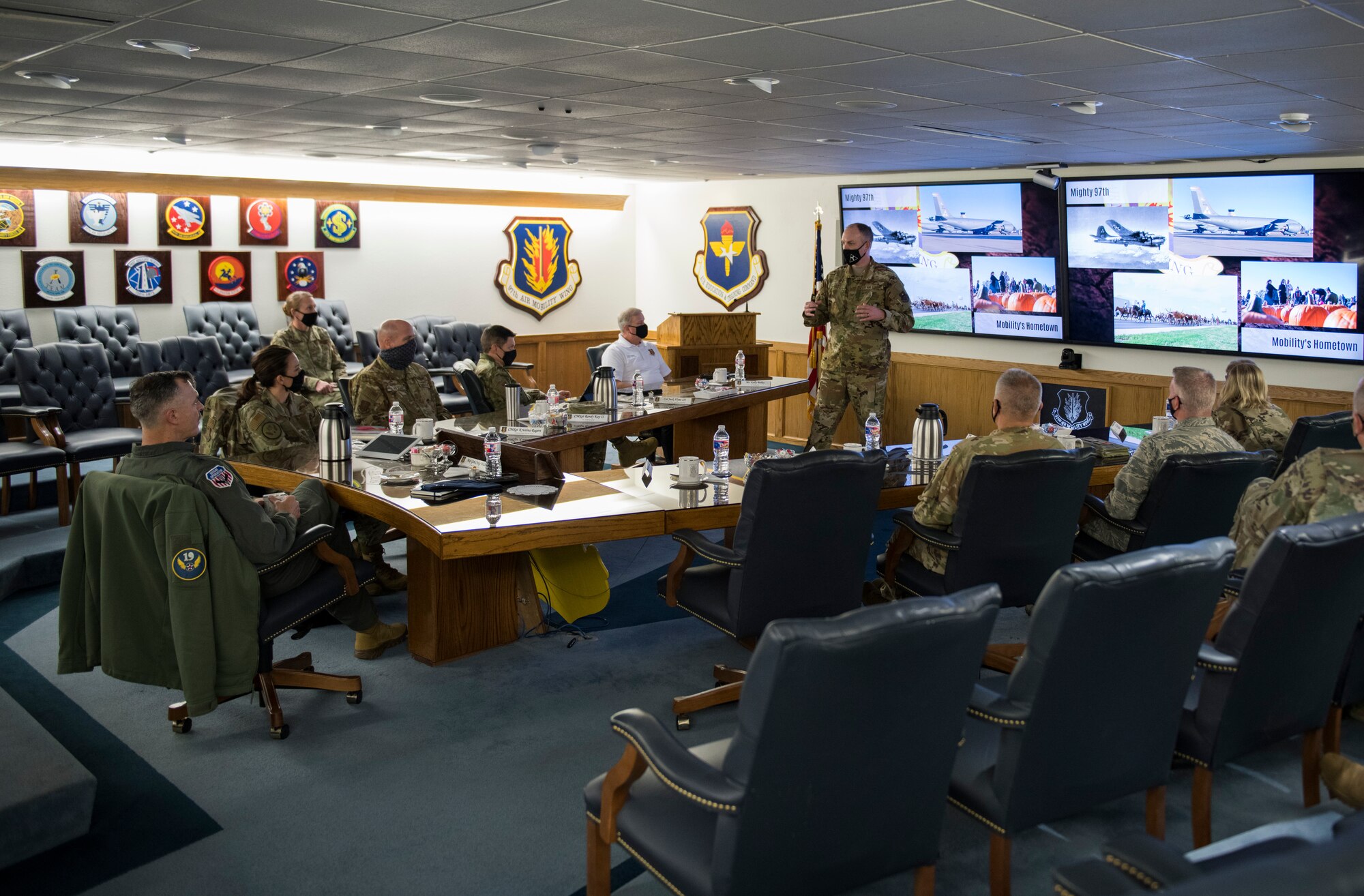 U.S. Air Force Col. Matthew Leard, 97th Air Mobility Wing (AMW) commander, briefs Maj. Gen. Craig Wills, 19th Air Force commander, and Chief Master Sgt. Kristina L. Rogers, 19th Air Force command chief], on March 29, 2020, at Altus Air Force Base, Oklahoma. During the brief, Leard provided updates about the 97th AMW mission and the installation's successes and challenges within the last year. (U.S. Air Force photo by Airman 1st Class Amanda Lovelace)