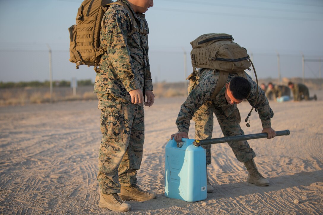 U.S. Marines with Headquarters and Headquarters Squadron (H&HS), compete in the monthly squadron competition on Marine Corps Air Station Yuma, Ariz., Oct. 9, 2020. The competition consisted of various challenges and obstacles as a way of improving morale and comradery while raising esprit de corps through competition. (U.S. Marine Corps photo by Lance Cpl. John Hall)