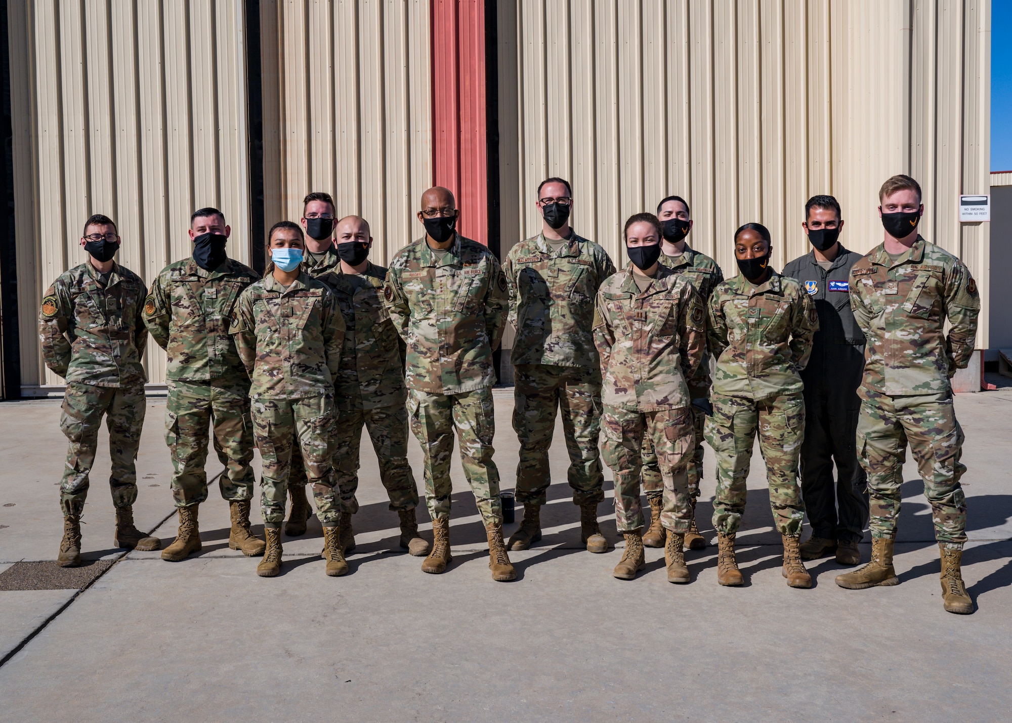 Air Force Chief of Staff Gen. Charles Q. Brown, Jr., poses for a photo with members of the 412th Test Wing during his visit to Edwards Air Force Base, California, March 31. (Air Force photo by Giancarlo Casem)