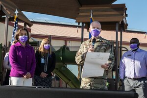 Brig. Gen. Matthew Higer, 412th Test Wing Commander, reads out loud the Month of the Military Child Proclamation at Edwards Air Force Base, California, April 1. Mrs. Sharene Brown, wife of Air Force Chief of Staff Gen. Charles Q. Brown, Jr., attended the event and provided her remarks. (Air Force photo by Joshua Miller)