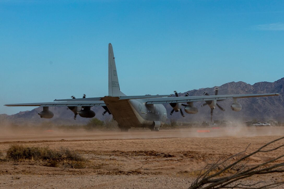 A U.S. Marine Corps KC-130J Hercules aircraft with Marine Aviation Weapons and Tactics Squadron One (MAWTS-1) lands at Assault Landing Zone (ALZ) Hawkeye aboard Marine Corps Air Station (MCAS) Yuma training ground, October 23, 2020. This was the first landing of an aircraft on an unimproved assault strip aboard MCAS Yuma.  (U.S. Marine Corps photo by Lance Cpl. Gabrielle Sanders)