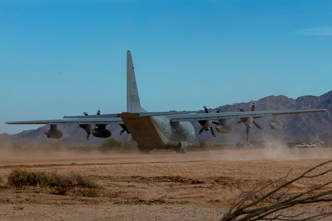 A U.S. Marine Corps KC-130J Hercules aircraft with Marine Aviation Weapons and Tactics Squadron One (MAWTS-1) lands at Assault Landing Zone (ALZ) Hawkeye aboard Marine Corps Air Station (MCAS) Yuma training ground, October 23, 2020. This was the first landing of an aircraft on an unimproved assault strip aboard MCAS Yuma.  (U.S. Marine Corps photo by Lance Cpl. Gabrielle Sanders)