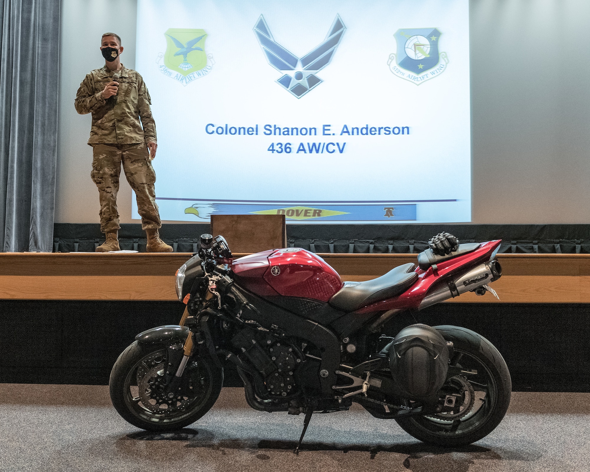 Col. Shanon Anderson, 436th Airlift Wing vice commander, makes opening remarks during the 2021 motorcycle safety preseason briefing at the base theater on Dover Air Force Base, Delaware, April 2, 2021. More than 100 motorcyclists attended the briefing as part of the 436th AW Safety office’s motorcycle safety day. (U.S. Air Force photo by Roland Balik)