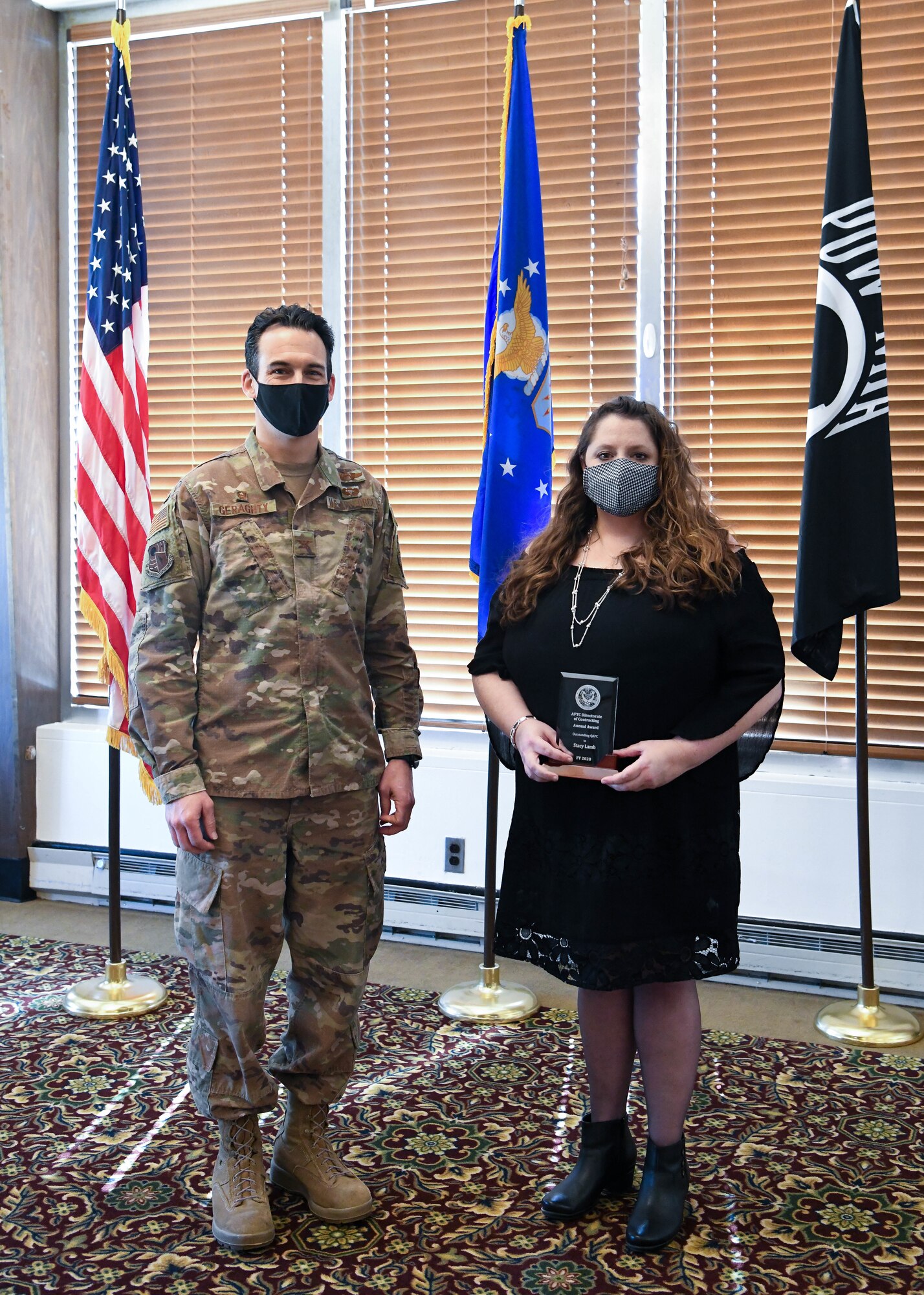 Stacey Lamb, the Arnold Engineering Development Complex Quality Assurance Program coordinator (QAPC) and Small Business specialist at Arnold Air Force Base, poses for a photo with AEDC Commander Col. Jeffrey Geraghty after the AEDC annual awards ceremony, Feb. 24, 2021, at Arnold Lakeside Complex at Arnold AFB, Tenn. (U.S. Air Force photo by Jill Pickett)