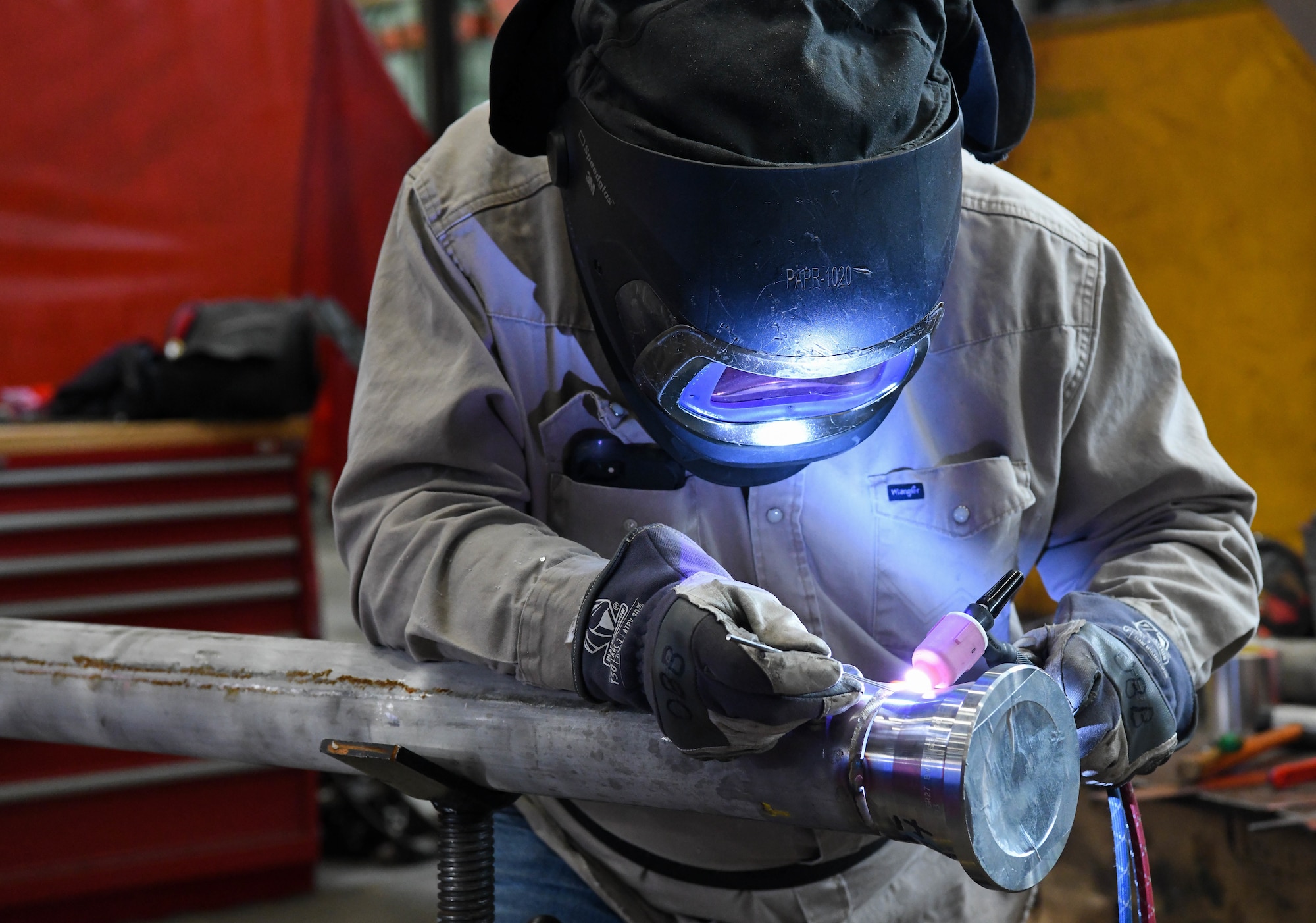 Pipefitter Billy Joe Emberton places tack welds before completely welding a flange onto a section of pipe, March 4, 2021, at the Model Shop at Arnold Air Force Base, Tenn. April is National Welding Month. (U.S. Air Force photo by Jill Pickett)