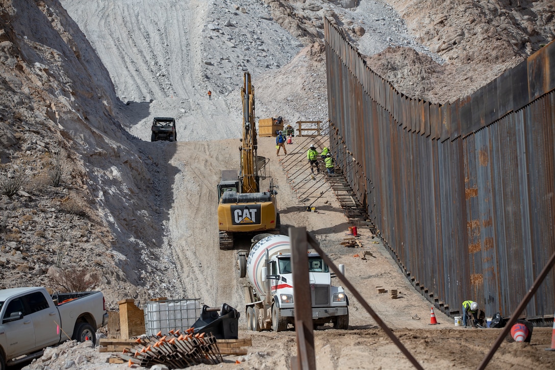 U.S. Navy Cmdr. Gareth Montgomery, the Installation & Logistics (I&L) Director, Marine Corps Air Station (MCAS) Yuma, views the ongoing construction of the border wall on the Barry M. Goldwater Range aboard MCAS Yuma, Oct 30, 2020. I&L is responsible for all military construction on the installation. (U.S. Marine Corps photo by LCpl. Gabrielle Sanders)