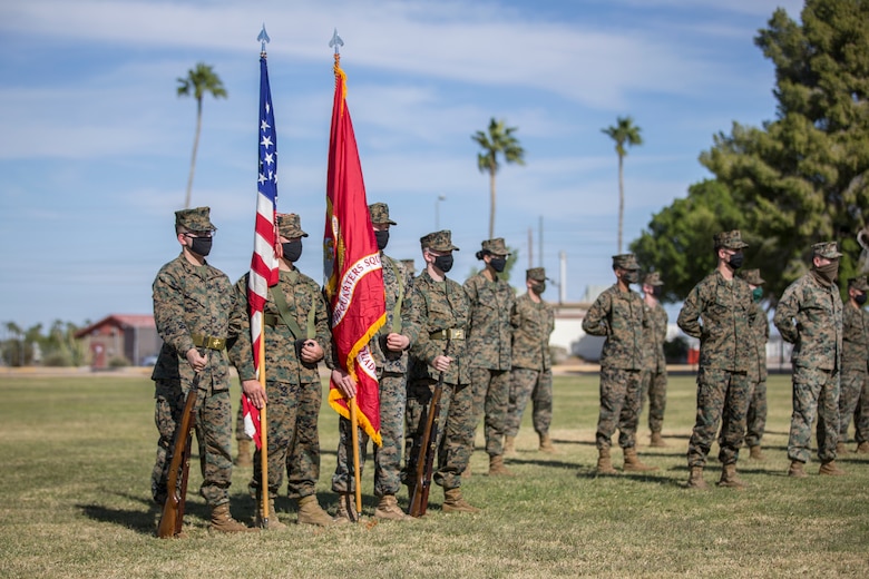 U.S. Marines with Marine Corps Air Station (MCAS) Yuma, participate in the 245th Marine Corps birthday cake cutting ceremony at the Parade Deck on MCAS Yuma, Ariz., Nov. 5, 2020. The annual ceremony was held in honor of the 245th Marine Corps birthday, signifying the passing of traditions from one generation to the next. (U.S. Marine Corps photo by Lance Cpl. John Hall)