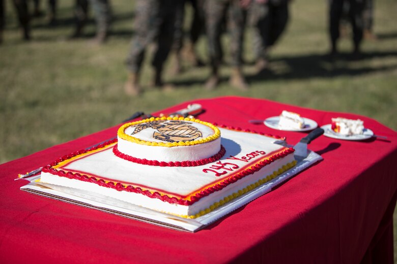 U.S. Marines with Marine Corps Air Station (MCAS) Yuma, participate in the 245th Marine Corps birthday cake cutting ceremony at the Parade Deck on MCAS Yuma, Ariz., Nov. 5, 2020. The annual ceremony was held in honor of the 245th Marine Corps birthday, signifying the passing of traditions from one generation to the next. (U.S. Marine Corps photo by Lance Cpl. John Hall)