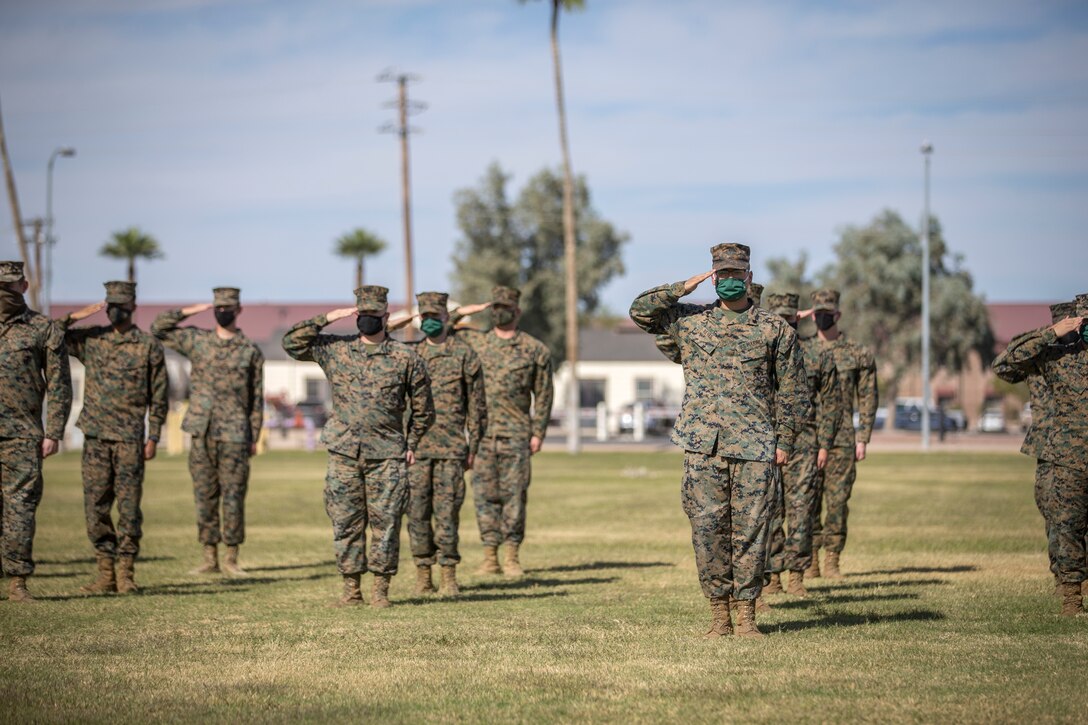 U.S. Marines with Marine Corps Air Station (MCAS) Yuma, participate in the 245th Marine Corps birthday cake cutting ceremony at the Parade Deck on MCAS Yuma, Ariz., Nov. 5, 2020.