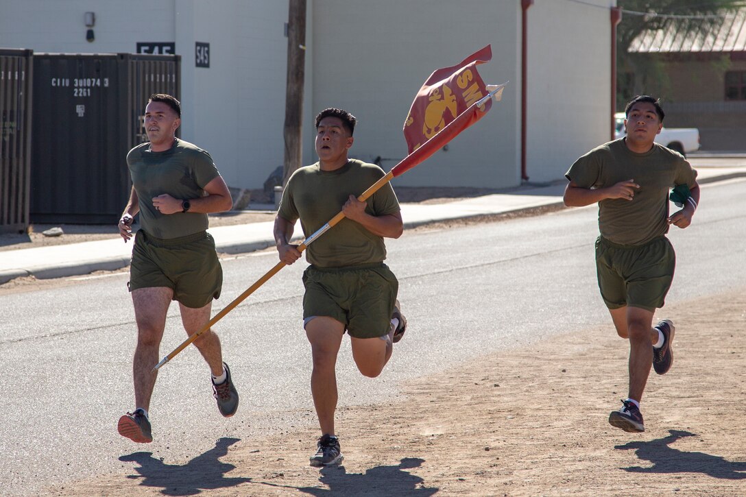 Cpl. Alexander McMurry, Cpl Augustus Smith, and Cpl Jonathan Ceja, avaition supply specialists, with Marine Aviation Logistics Squadron 13 (MALS-13) run two miles for the Marine Corps Birthday run aboard Marine Corps Air Station (MCAS) Yuma, Nov. 4 2020.
