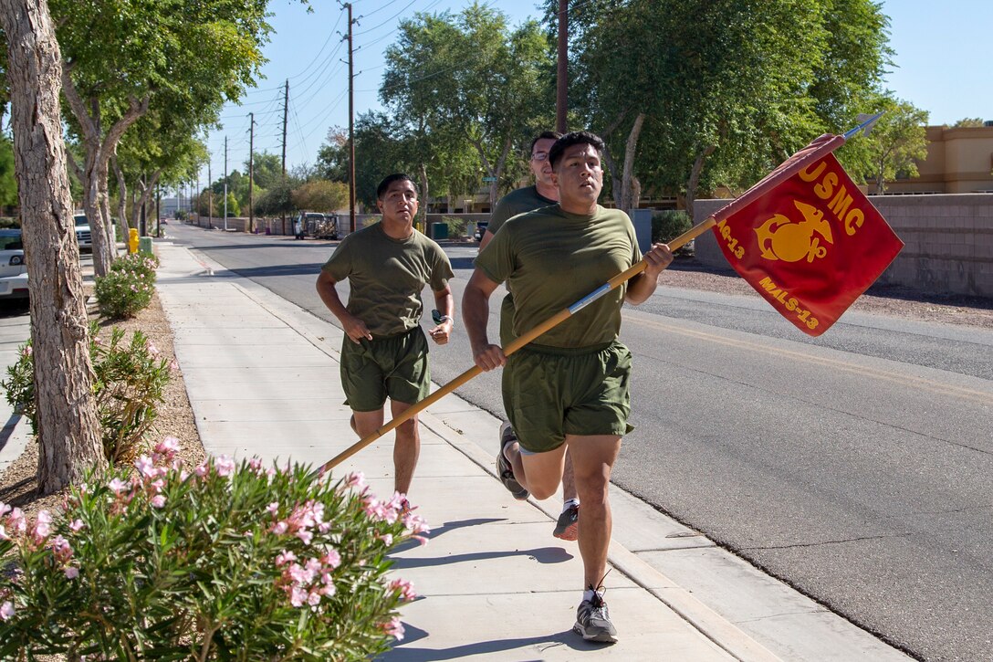 Cpl. Alexander McMurry, Cpl Augustus Smith, and Cpl Jonathan Ceja, avaition supply specialists, with Marine Aviation Logistics Squadron 13 (MALS-13) run two miles for the Marine Corps Birthday run aboard Marine Corps Air Station (MCAS) Yuma, Nov. 4 2020.