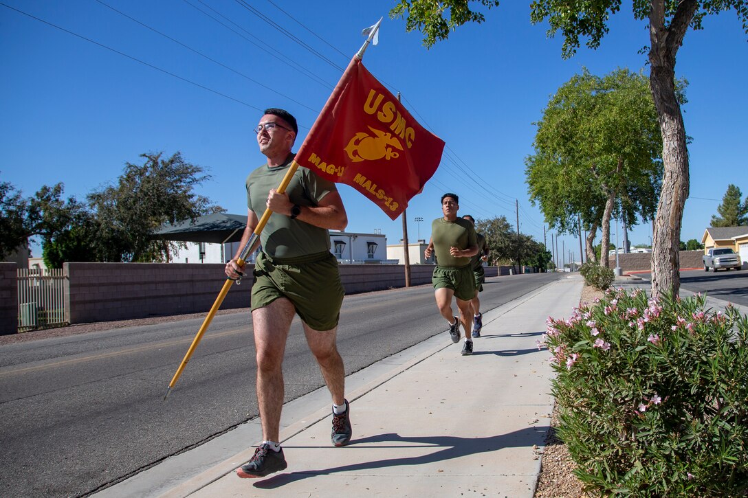 Cpl. Alexander McMurry, Cpl Augustus Smith, and Cpl Jonathan Ceja, avaition supply specialists, with Marine Aviation Logistics Squadron 13 (MALS-13) run two miles for the Marine Corps Birthday run aboard Marine Corps Air Station (MCAS) Yuma, Nov. 4 2020.