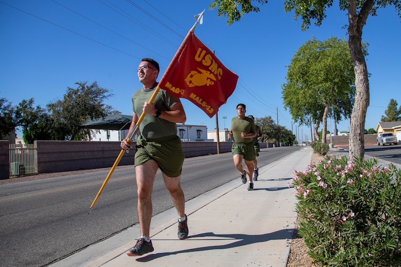 Cpl. Alexander McMurry, Cpl Augustus Smith, and Cpl Jonathan Ceja, avaition supply specialists, with Marine Aviation Logistics Squadron 13 (MALS-13) run two miles for the Marine Corps Birthday run aboard Marine Corps Air Station (MCAS) Yuma, Nov. 4 2020. Marines with MALS-13 run a total of 245 miles in honor of the 245th Marine Corps Birthday. (U.S. Marine Corps photo by LCpl. Gabrielle Sanders)
