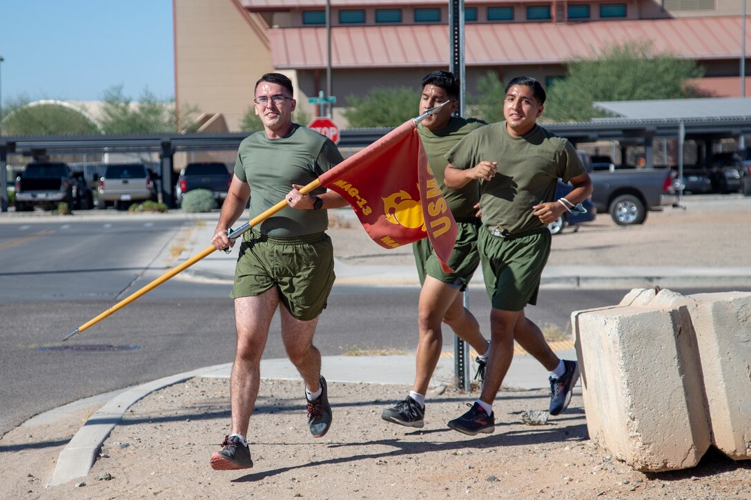 Cpl. Alexander McMurry, Cpl Augustus Smith, and Cpl Jonathan Ceja, avaition supply specialists, with Marine Aviation Logistics Squadron 13 (MALS-13) run two miles for the Marine Corps Birthday run aboard Marine Corps Air Station (MCAS) Yuma, Nov. 4 2020. Marines with MALS-13 run a total of 245 miles in honor of the 245th Marine Corps Birthday. (U.S. Marine Corps photo by LCpl. Gabrielle Sanders)