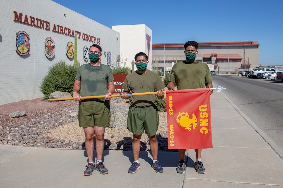 Cpl. Alexander McMurry, Cpl Augustus Smith, and Cpl Jonathan Ceja, avaition supply specialists, with Marine Aviation Logistics Squadron 13 (MALS-13) run two miles for the Marine Corps Birthday run aboard Marine Corps Air Station (MCAS) Yuma, Nov. 4 2020. Marines with MALS-13 run a total of 245 miles in honor of the 245th Marine Corps Birthday. (U.S. Marine Corps photo by LCpl. Gabrielle Sanders)