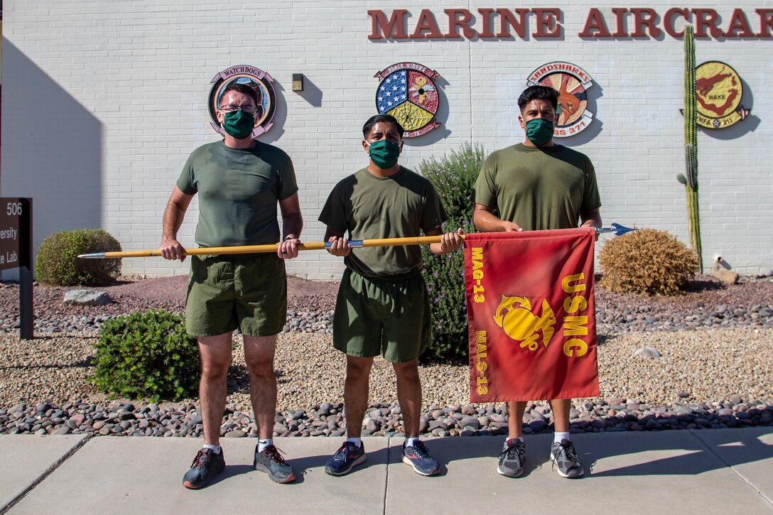 Cpl. Alexander McMurry, Cpl Augustus Smith, and Cpl Jonathan Ceja, avaition supply specialists, with Marine Aviation Logistics Squadron 13 (MALS-13) run two miles for the Marine Corps Birthday run aboard Marine Corps Air Station (MCAS) Yuma, Nov. 4 2020.