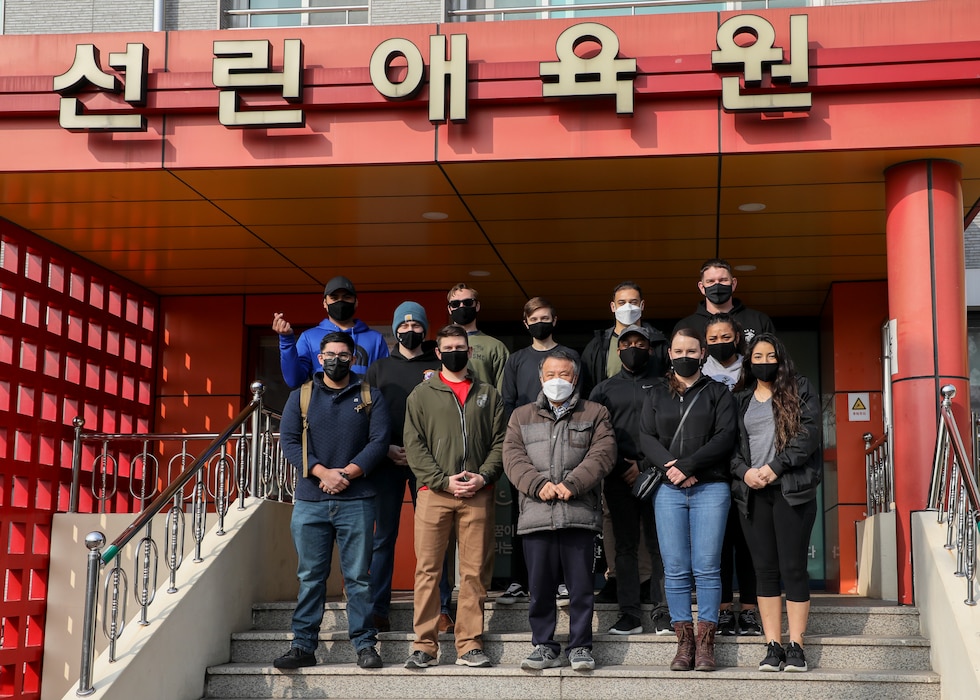 U.S. Marines with U.S. Marine Corps Forces – Korea pose with Mr. Park, Jung Min, Chief of Pohang Sunrin Orphanage, for a photo during a volunteer event at Sunrin Orphanage, Pohang, South Korea, March 13, 2021.