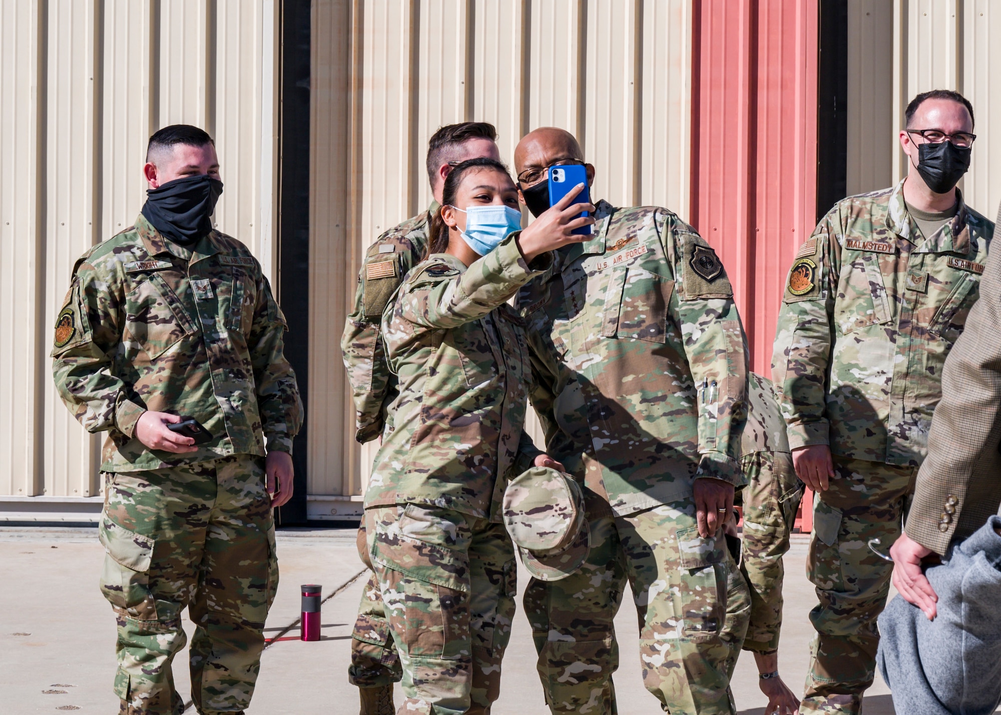 Airman Stephany Rayas-Calderon, 412th Comptroller Squadron, takes a selfie with Air Force Chief of Staff Gen. Charles Q. Brown, Jr., during his visit to Edwards Air Force Base, Calif., March 31, 2021.