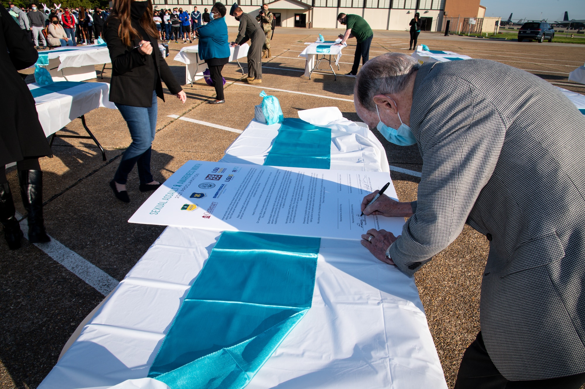 Lo Walker, Bossier City mayor, signs a Sexual Assault Awareness Month proclamation at Barksdale Air Force Base, Louisiana, April 2, 2021.
