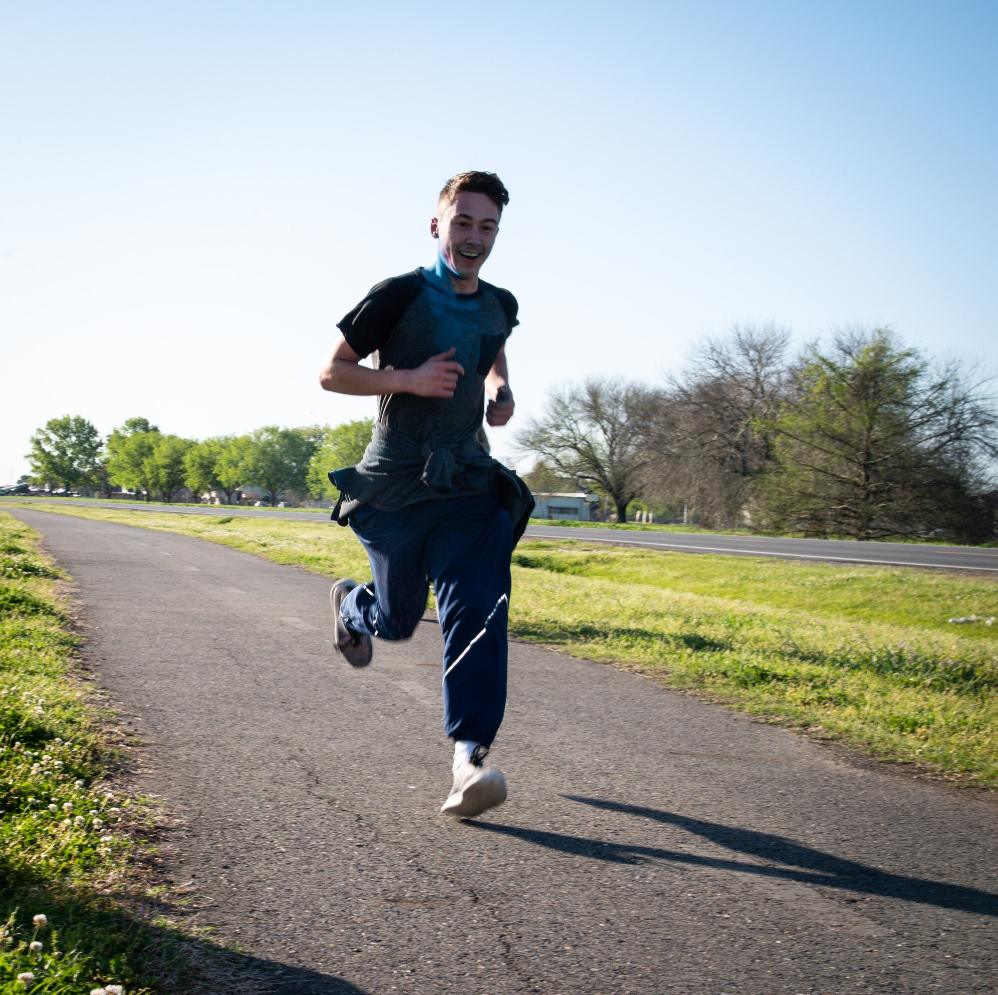 A participant in the Sexual Assault Awareness Month 5K run nears the halfway checkpoint at Barksdale Air Force Base, Louisiana, April 2, 2021.