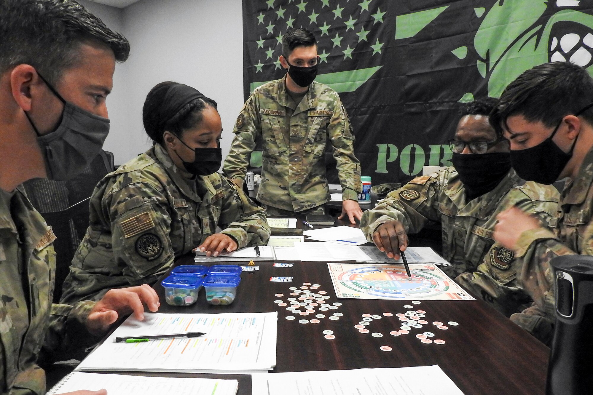 Airmen from various units within the 621st Contingency Response Wing play a prototype military strategy game March 26, 2021, at Travis Air Force Base, California. The game is called “Kingfish ACE” and focuses on real-world responses for Air Force leadership. (U.S. Air Force photo by Senior Airman Chad Kotce)