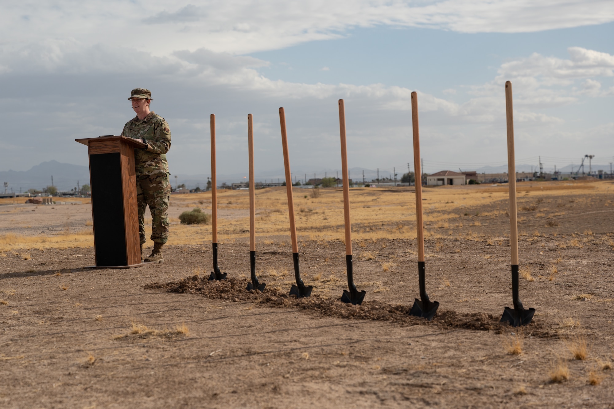 An Airman talking at a podium