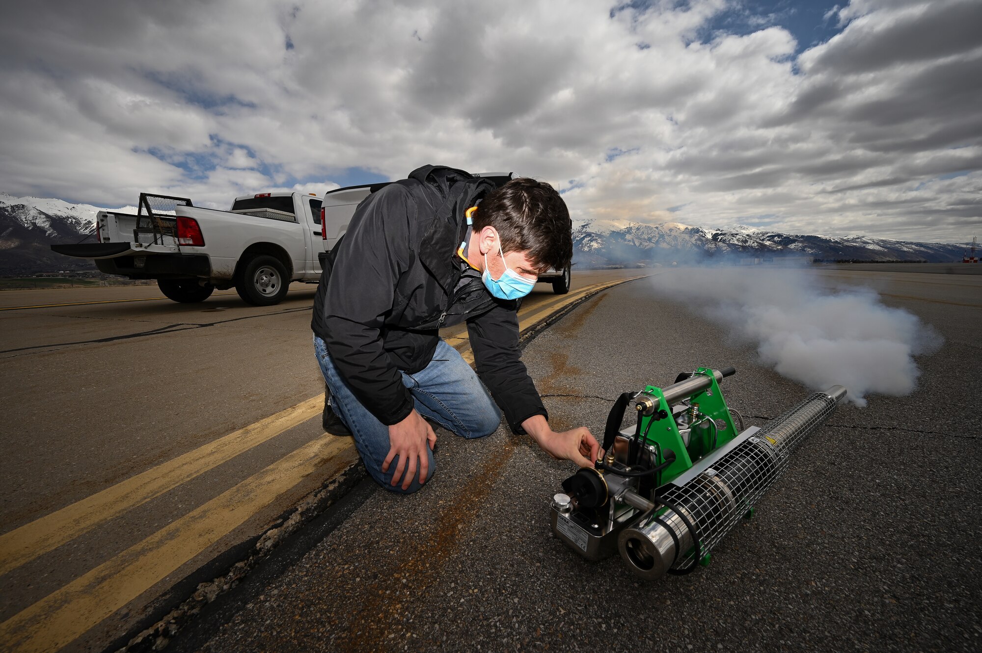 Tyler Adams, U.S. Department of Argriculture wildlife biologist, starts a bird fogger at Hill Air Force Base, Utah.