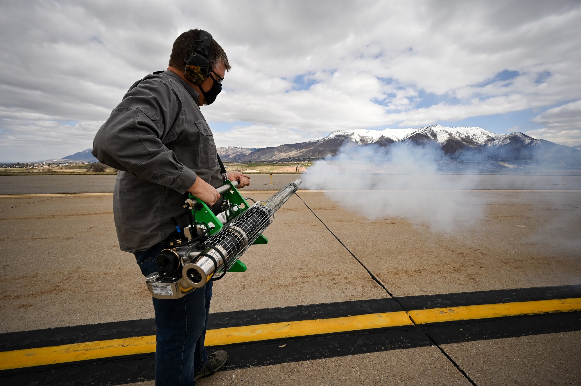 Ryan Carter, U.S. Department of Argriculture wildlife technician, operates a bird fogger at Hill Air Force Base, Utah.