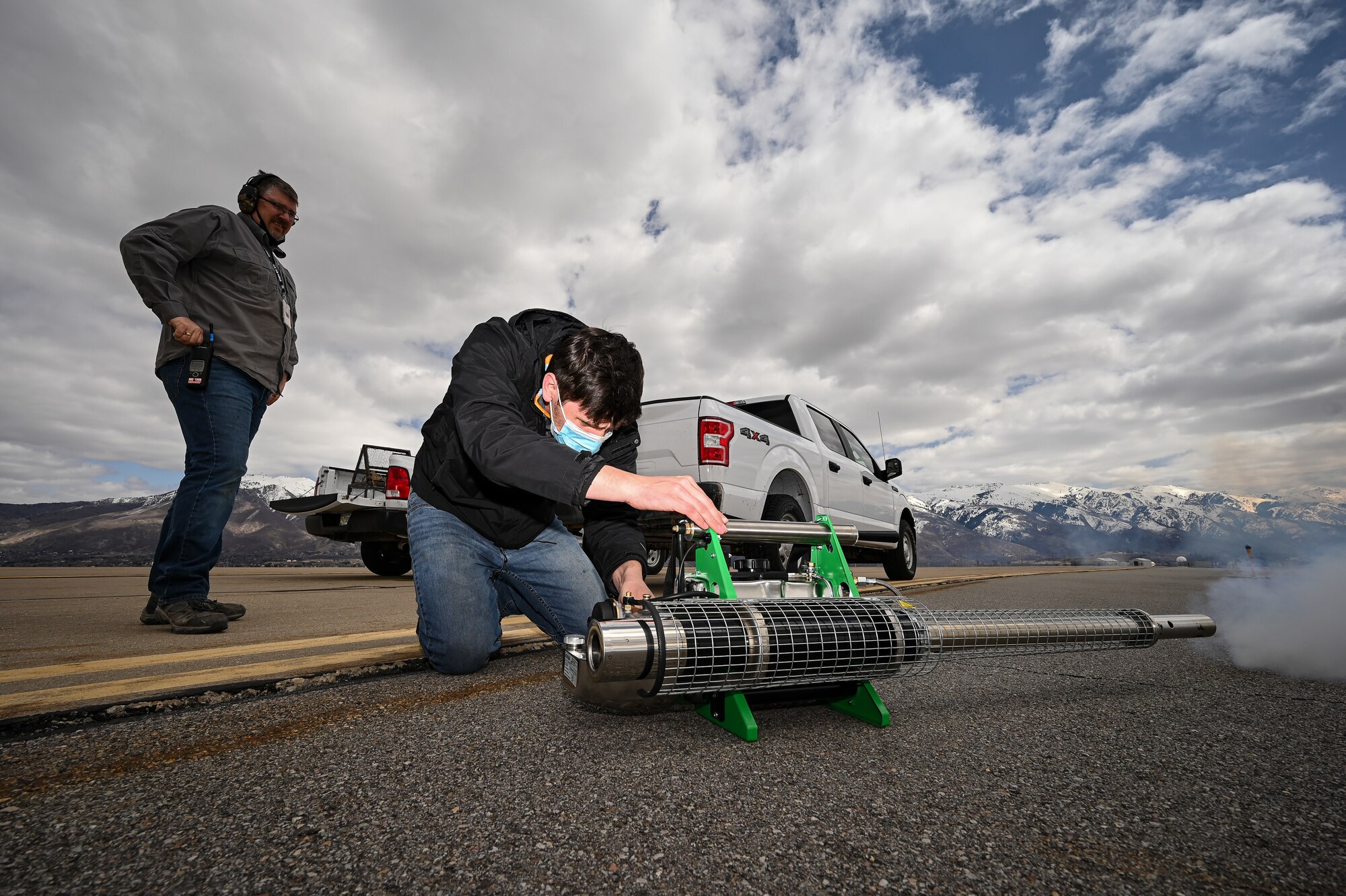 Tyler Adams, U.S. Department of Argriculture wildlife biologist, starts a bird fogger at Hill Air Force Base, Utah.
