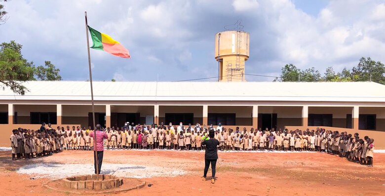 Dozens of students pose in front of a recently completed school facility in Kpomasse, Benin in Africa. The school is one of three school projects in the country recently constructed by the U.S. Army Corps of Engineers, Europe District. The U.S. Army Corps of Engineers, Europe District manages the constructions of Humanitarian Assistance projects like this one and others in Benin and in several other countries throughout Africa in support of AFRICOM and coordinated closely with the U.S. State Department.