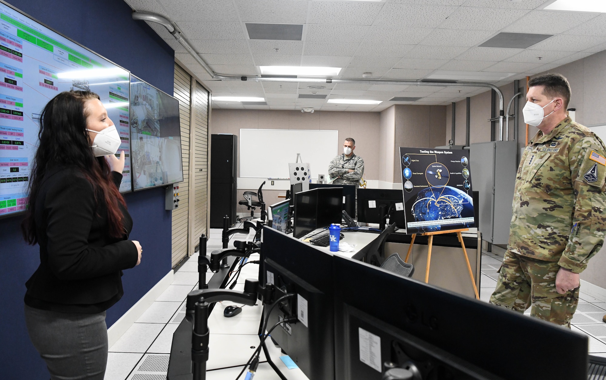 Kellye Burns, space test engineer, left, speaks about the Arnold Engineering Development Complex Space Asset Resilience capability to Gen. David Thompson, vice chief of space operations, U.S. Space Force, during a tour of the Space Threat Assessment Testbed control room at Arnold Air Force Base, Tenn., headquarters of AEDC, Feb. 5, 2021. (U.S. Air Force photo by Jill Pickett)