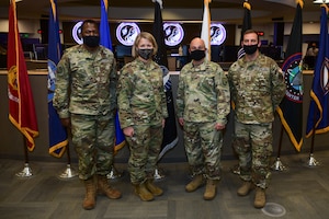 Leaders take photo on ops floor