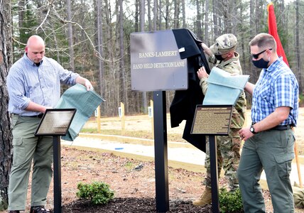 Current and former Virginia National Guard Soldiers and guests attend a dedication ceremony for the new Banks-Lambert Handheld Detection Lane March 26, 2021, at Fort Pickett, Virginia.