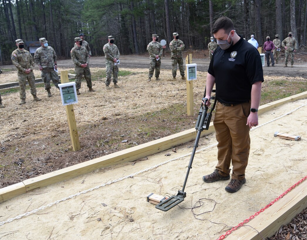 Current and former Virginia National Guard Soldiers and guests attend a dedication ceremony for the new Banks-Lambert Handheld Detection Lane March 26, 2021, at Fort Pickett, Virginia.