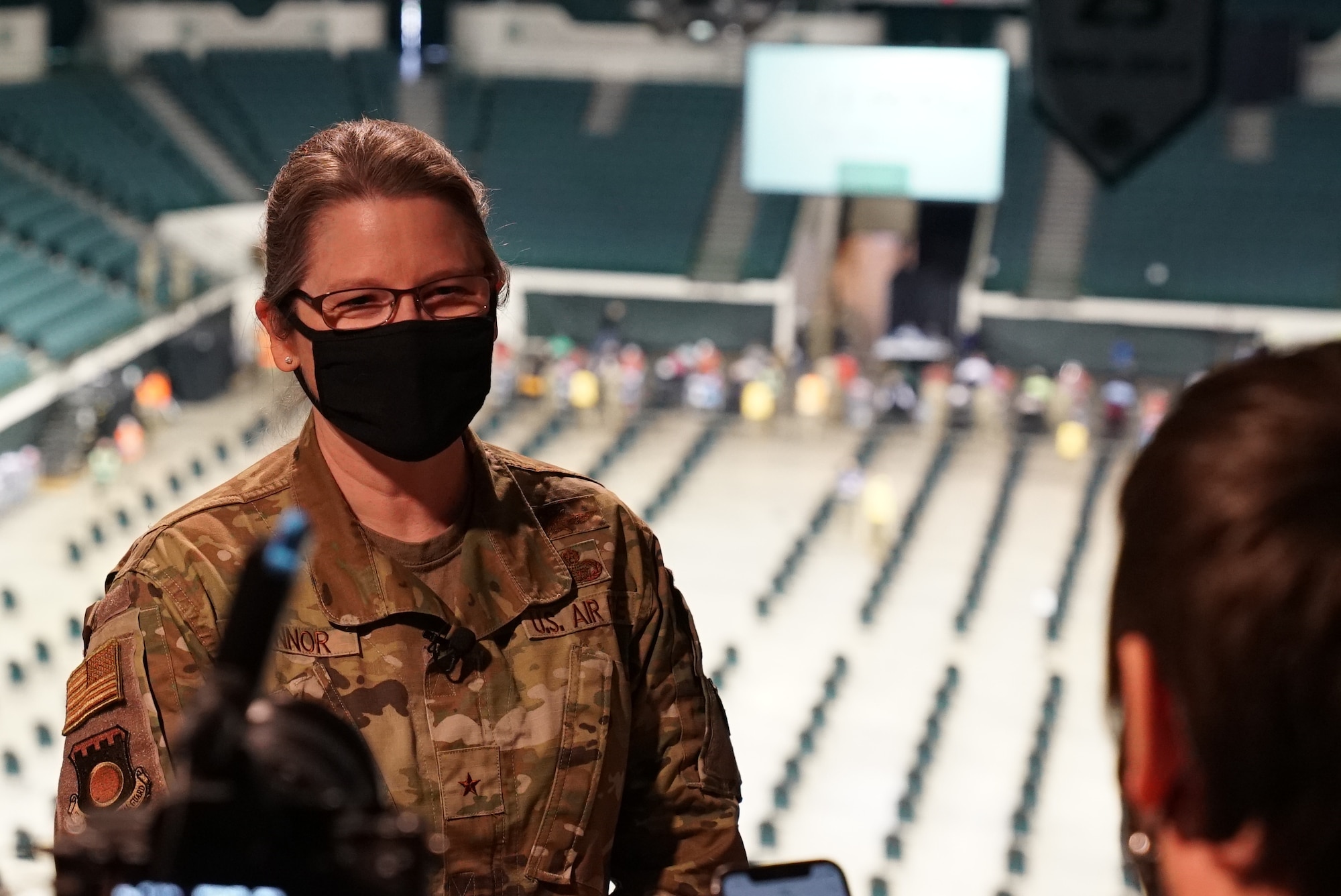 Ohio National Guard Brig. Gen. Rebecca O’Connor is interviewed by a television reporter at the state-run, federally supported Community Vaccination Center at Cleveland State University, March 16, 2021, in Cleveland. O’Connor is the dual-status commander in charge of the CVC, which is staffed by about 540 Ohio National Guard and active-duty service members and local, state and federal agencies.