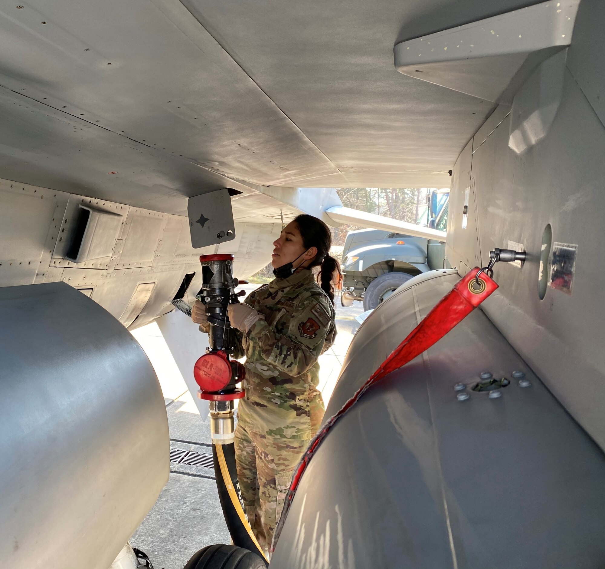 U.S. Air Force Tech Sgt. Rossmery Aragon-Leonard, 480th Fighter Squadron independent duty medical technician, refuels an U.S Air Force F-16 Fighting Falcon, during an Agile Combat Employment exercise at Ramstein Air Base, March 24, 2021.  Agile Combat Employment is an operational concept that allows forces to generate sorties from various locations with the support of multi-capable Airmen. (U.S. Air Force photo by Tech Sgt. Warren Spearman Jr.)