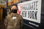 Senior Airman Can Liu, from Queens, N.Y., and a 335th Expeditionary Medical Operations Squadron general purpose Airman, pose for a photo at the state-led, federally-supported Medgar Evers College Community Vaccination Center in Brooklyn, N.Y., March 24, 2021. Liu, who is deployed from the 20th Civil Engineer Squadron out of Tyndall Air Force Base, Fla., was born in Fushun, China, is fluent in Mandarin, and moved to the U.S. with her family when she was nine years old. Liu is able to translate for Chinese community members who have questions while receiving their COVID-19 vaccination. (U.S. Air Force photo by Tech. Sgt. Ashley Nicole Taylor)