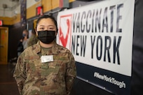 Senior Airman Can Liu, from Queens, N.Y., and a 335th Expeditionary Medical Operations Squadron general purpose Airman, pose for a photo at the state-led, federally-supported Medgar Evers College Community Vaccination Center in Brooklyn, N.Y., March 24, 2021. Liu, who is deployed from the 20th Civil Engineer Squadron out of Tyndall Air Force Base, Fla., was born in Fushun, China, is fluent in Mandarin, and moved to the U.S. with her family when she was nine years old. Liu is able to translate for Chinese community members who have questions while receiving their COVID-19 vaccination. (U.S. Air Force photo by Tech. Sgt. Ashley Nicole Taylor)