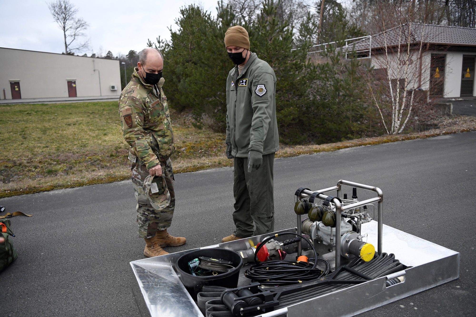 U.S. Air Force Col. David Epperson, 52nd Fighter Wing commander, shows the Viper Kit to U.S. Air Force Gen. Jeffery Harrigian, United States Air Forces in Europe and Air Forces Africa commander, during an Agile Combat Employment exercise at Ramstein Air Base, Germany, March 22, 2021. The Viper Kit is a small self-contained, portable, hot-pit-capable servicing platform that allows fuels Airmen to hot and cold pit refuel aircraft in austere locations. (U.S. Air Force photo by Tech. Sgt. Warren D. Spearman Jr.)