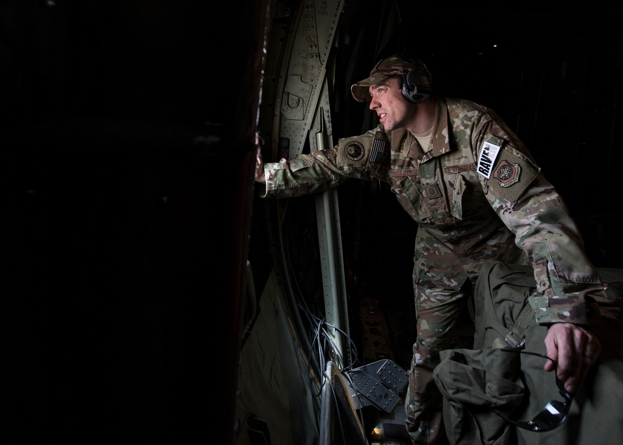 U.S. Air Force Master Sgt. Lief Christensen, 133rd Security Forces Squadron, Minnesota Air National Guard Phoenix Raven team leader, checks outside after landing in a C-130J Super Hercules at Kaedi Airfield, Mauritania, Feb. 22, 2020.