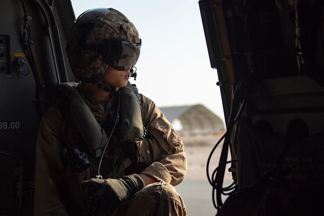 U.S. Marine Corps Cpl. Ewoo Jung, an MV-22 Osprey crew chief assigned to Marine Medium Tiltrotor Squadron 164, 15th Marine Expeditionary Unit, awaits takeoff during a U.S. Air Forces Central Agile Combat Employment event at Al Udeid Air Base, Qatar, March 4, 2021. AFCENT’s ACE capstone event enhances theater airpower competencies, validating operational capabilities and command and control while simultaneously strengthening regional partnerships. The 15th MEU is deployed to the U.S. 5th Fleet area of operations in support of naval operations to ensure maritime stability and security in the Central Region, connecting the Mediterranean and Pacific through the western Indian Ocean and three strategic choke points.