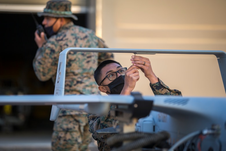 U.S. Marines with Marine Unmanned Aerial Vehicle Squadron (VMU) 1 set up and launch a RQ-21 "Blackjack" unmanned aerial vehicle (UAV) on Canon Air Defense Complex in Yuma, Arizona, Nov. 5, 2020. The RQ-21 is designed to support Marine Corps mission readiness by providing forward reconnaissance without having to put Marine Corps personnel at risk.(U.S. Marine Corps photo by Lance Cpl. John Hall)