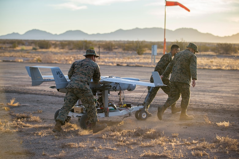 U.S. Marines with Marine Unmanned Aerial Vehicle Squadron (VMU) 1 set up and launch a RQ-21 "Blackjack" unmanned aerial vehicle (UAV) on Canon Air Defense Complex in Yuma, Arizona, Nov. 5, 2020. The RQ-21 is designed to support Marine Corps mission readiness by providing forward reconnaissance without having to put Marine Corps personnel at risk.(U.S. Marine Corps photo by Lance Cpl. John Hall)