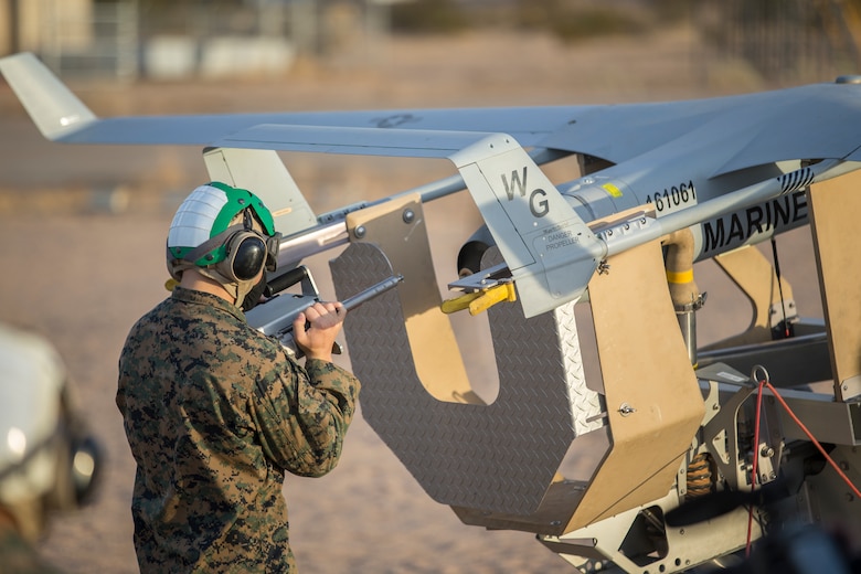 U.S. Marines with Marine Unmanned Aerial Vehicle Squadron (VMU) 1 set up and launch a RQ-21 "Blackjack" unmanned aerial vehicle (UAV) on Canon Air Defense Complex in Yuma, Arizona, Nov. 5, 2020. The RQ-21 is designed to support Marine Corps mission readiness by providing forward reconnaissance without having to put Marine Corps personnel at risk.(U.S. Marine Corps photo by Lance Cpl. John Hall)