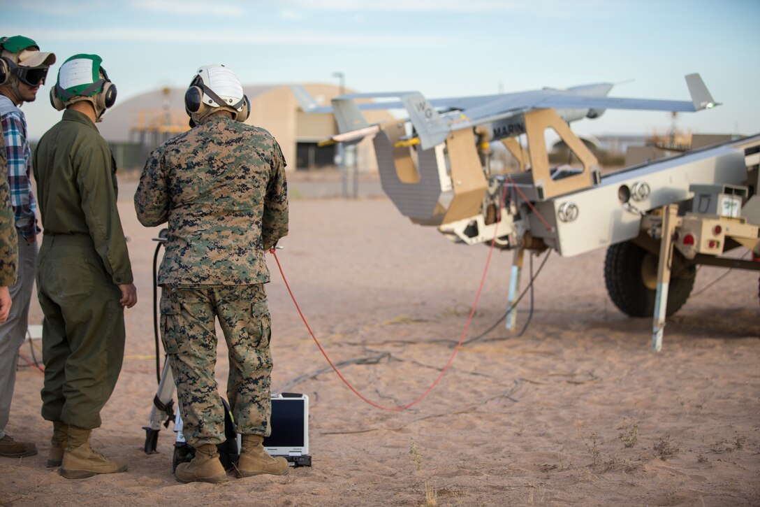 U.S. Marines with Marine Unmanned Aerial Vehicle Squadron (VMU) 1 set up and launch a RQ-21 "Blackjack" unmanned aerial vehicle (UAV) on Canon Air Defense Complex in Yuma, Arizona, Nov. 5, 2020. The RQ-21 is designed to support Marine Corps mission readiness by providing forward reconnaissance without having to put Marine Corps personnel at risk.(U.S. Marine Corps photo by Lance Cpl. John Hall)